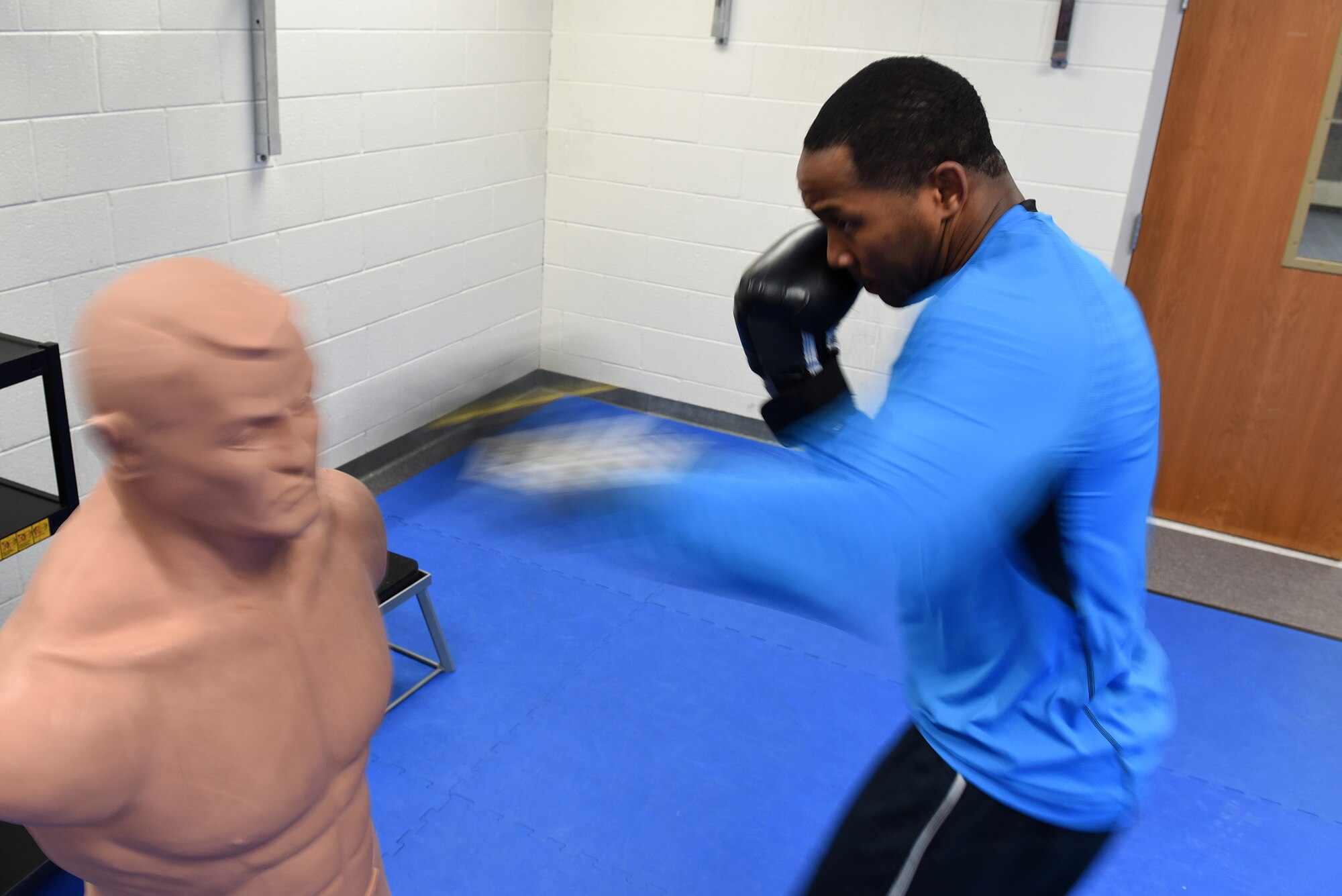 MCGHEE TYSON AIR NATIONAL GUARD BASE, Tenn. - Tech. Sgt. DeAndrew Williams, EPME instructor with the Paul H. Lankford EPME Center, strikes a training dummy to warm up before sparring sessions here Feb. 10, 2016, in Wilson Hall. The I.G. Brown Training and Education Center holds a variety of fitness classes, including the recent boxing class offered by Tech. Sgt. Angelo Gomez. (U.S. Air National Guard photo by Master Sgt. Mike R. Smith/Released)