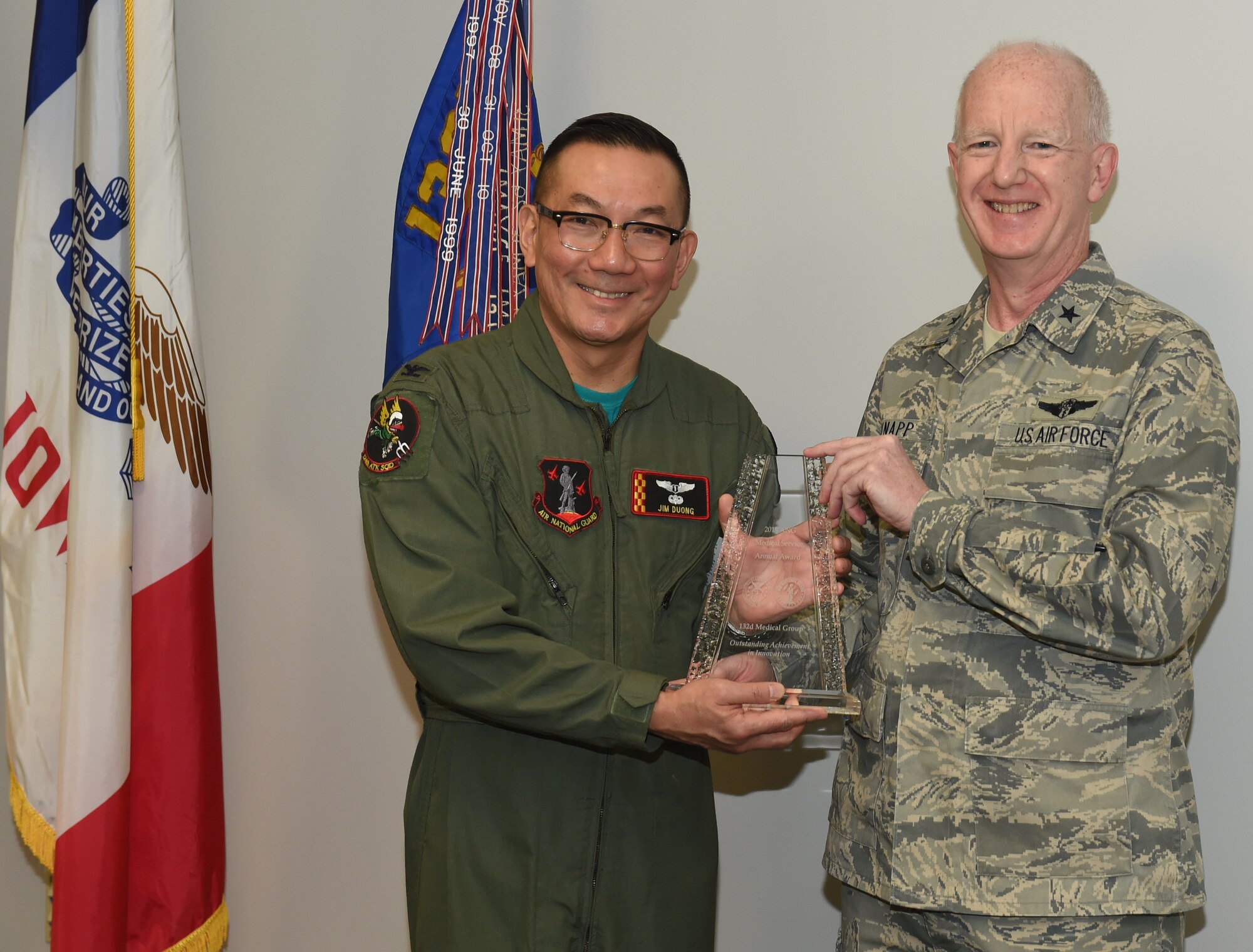 U.S. Air Force Brig. Gen. Christopher Knapp gives Col. Jim Duong the 2015 ANG Medical Service Annual Award for Outstanding Achievement in Innovation. (U.S. Air National Guard photo by Staff Sgt. Matthew T. Doyle/Released)