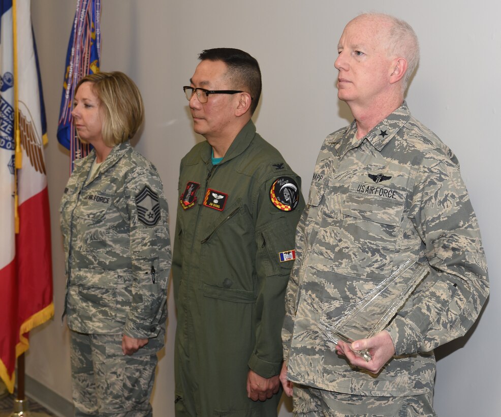 U.S. Air Force Brig. Gen. Christopher Knapp gives Col. Jim Duong and Chief Master Sgt. Kris Rode the 2015 ANG Medical Service Annual Award for Outstanding Achievement in Innovation. (U.S. Air National Guard photo by Staff Sgt. Matthew T. Doyle/Released)