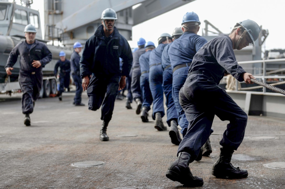 U.S. sailors aboard the USS Fort McHenry heave line during a replenishment at sea in the Atlantic Ocean, Feb. 6, 2016. The McHenry is slated to participate in Exercise Cold Response 2016 with thirteen allied and partner nations. Navy photo by Petty Officer 3rd Class Andrew Murray