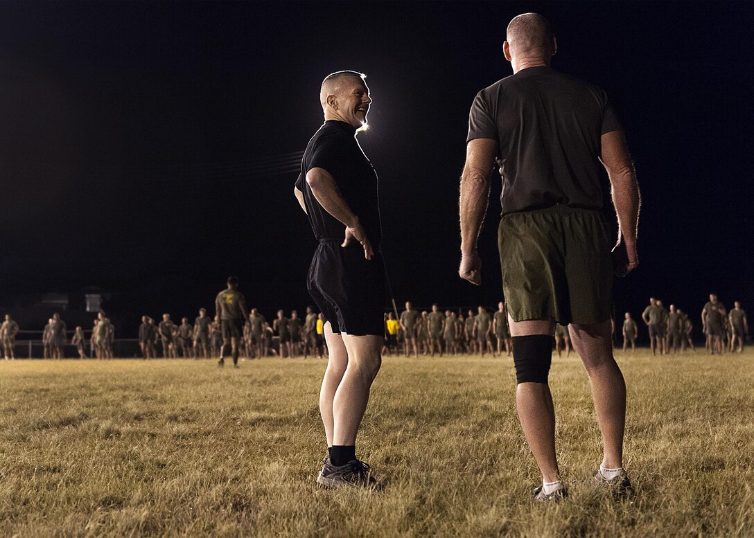 Army Command Sgt. Maj. John W. Troxell, left, senior enlisted advisor to the chairman of the Joint Chiefs of Staff, speaks with Marine Corps Sgt. Maj. Paul McKenna, senior enlisted advisor for U.S. Marine Corps Forces, Pacific , before an early morning physical training session with sailors and Marines at Camp H.M. Smith, Hawaii, Feb. 10, 2016. Troxell worked out with the troops for an hour and then held a brief question and answer session. DoD photo by Navy Petty Officer 2nd Class Dominique A. Pineiro