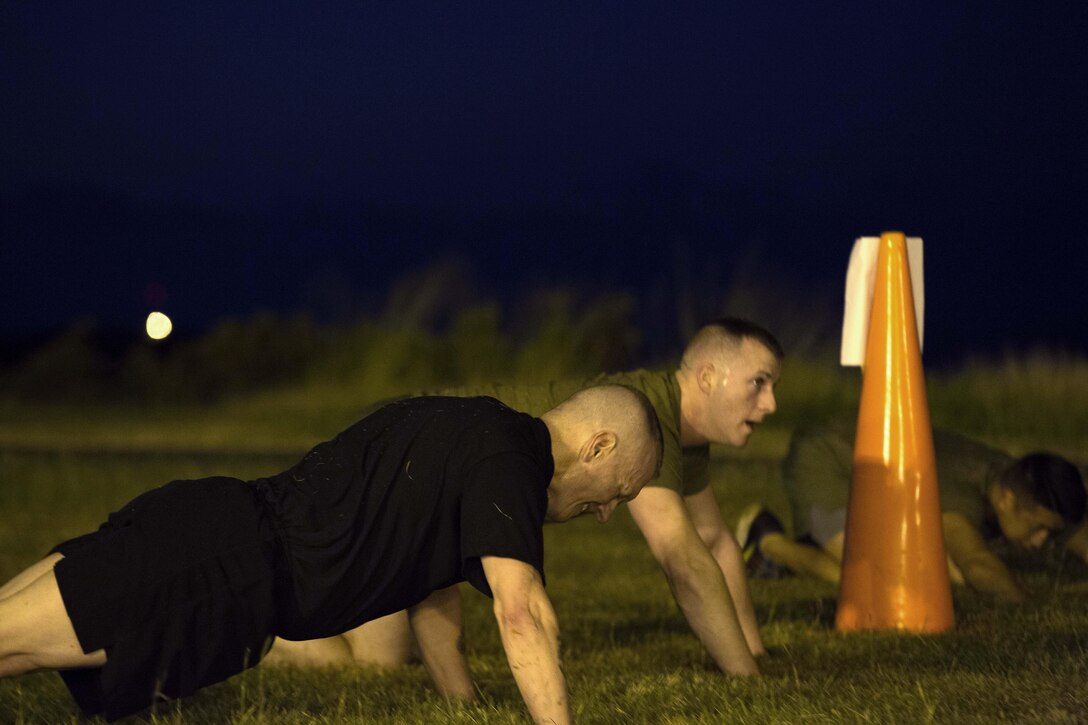 Army Command Sgt. Maj. John W. Troxell, foreground, senior enlisted advisor to the chairman of the Joint Chiefs of Staff, does pushups during a morning physical training session with sailors and Marines at Camp H.M. Smith, Hawaii, Feb. 10, 2016. Marine Corps photo by Sgt. Erik Estrada
