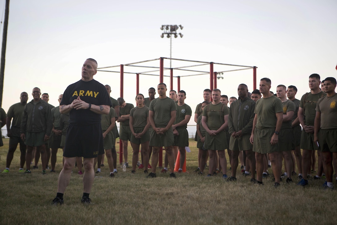 Army Command Sgt. Maj. John W. Troxell, center left, senior enlisted advisor to the chairman of the Joint Chiefs of Staff, prepares to do 22 pushups for veterans after participating in morning physical training at Camp H.M. Smith, Hawaii, Feb. 10, 2016. Marine Corps photo by Sgt. Erik Estrada