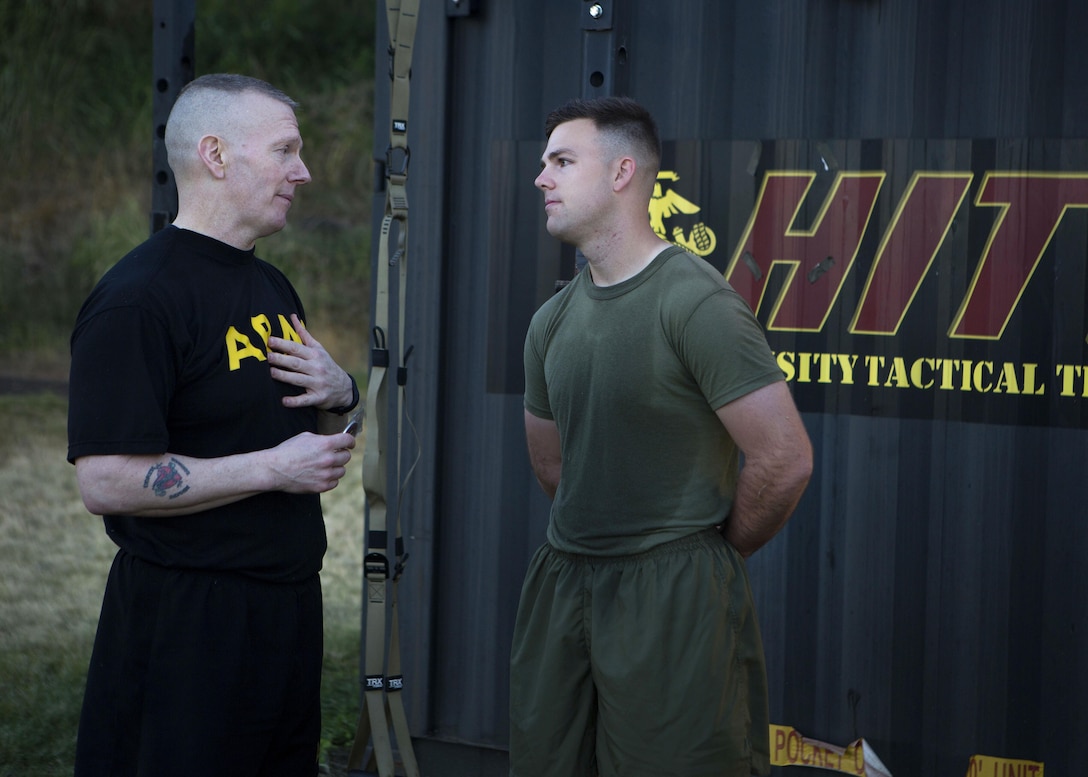 Army Command Sgt. Maj. John W. Troxell, left, senior enlisted advisor to the chairman of the Joint Chiefs of Staff, talks with Marine Corps Sgt. Matthew Bragg after a morning physical training session at Camp H.M. Smith, Hawaii, Feb. 10, 2016. Bragg is a mass communicator assigned to U.S. Marine Corps Forces, Pacific. Marine Corps photo by Sgt. Erik Estrada
