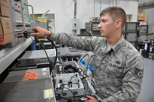 Staff Sgt. Alexander Rex, the 379th Expeditionary Maintenance Squadron avionics intermediate systems team leader from Fargo, N.D., tests an ultra-high frequency radio transmitter at Al Udeid Air Base, Qatar Feb. 9, 2016. The 379th EMXS avionics flight performed 56 maintenance inspections over the past six months. (U.S. Air Force photo/Tech. Sgt. James Hodgman)