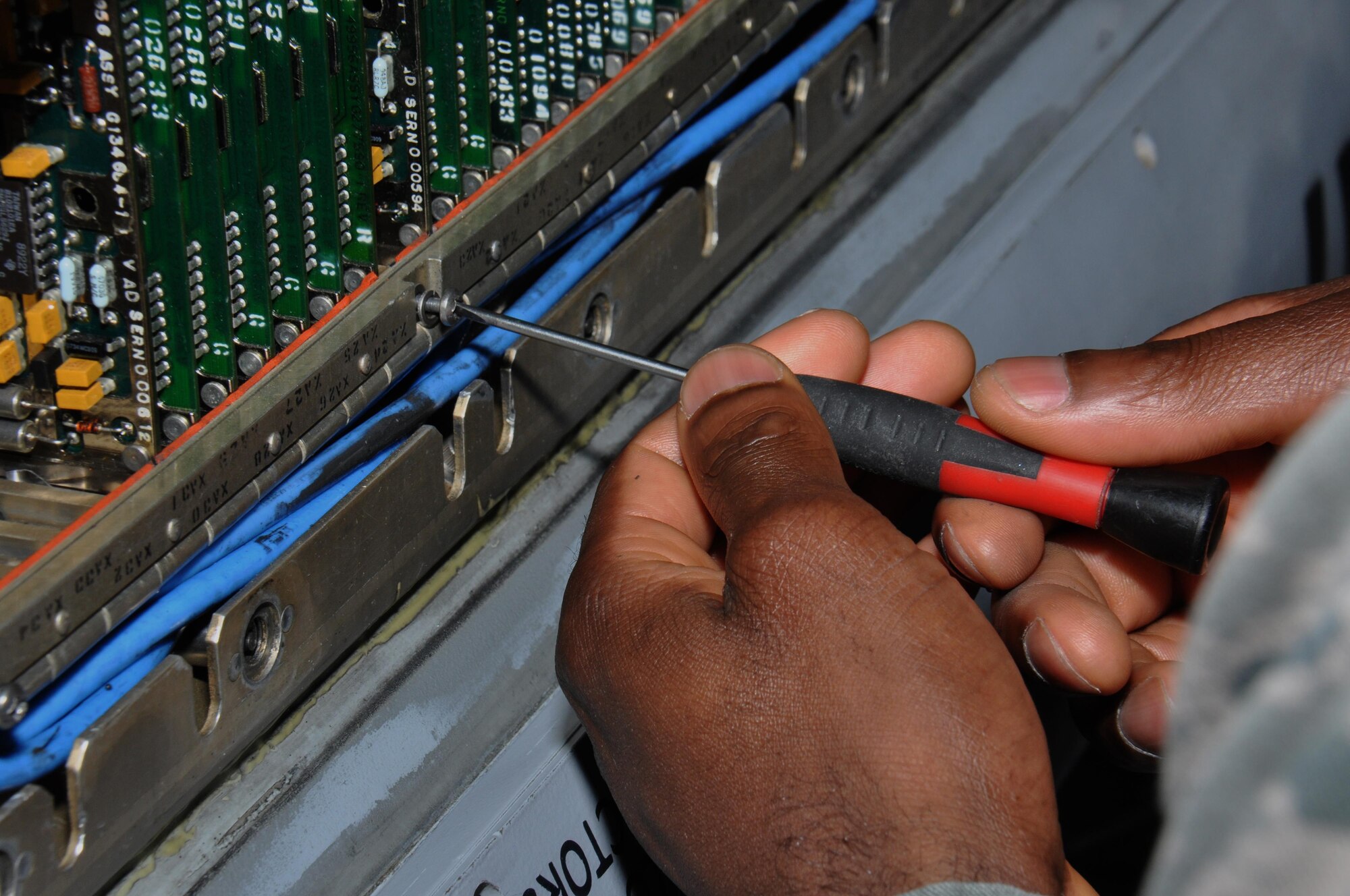 Senior Airman Romanov Saint-Fort, 379th Expeditionary Maintenance Squadron avionics electronic countermeasures technician from Seaford, Delaware, works to find a fluid leak on an electronic warfare attack pod at Al Udeid Air Base, Qatar Feb. 9. The 379th ECM team is responsible for maintaining $83 million in equipment. The avionics flight performed 56 maintenance inspections over the past six months. (U.S. Air Force photo by Tech. Sgt. James Hodgman/Released)