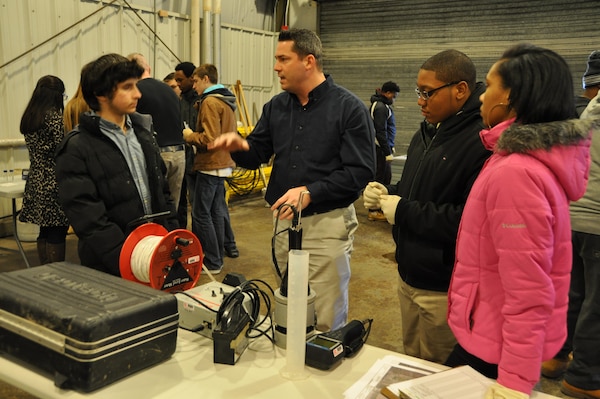 Buffalo District USACE chemists Peter Lorey and Matthew Massey demonstrate water sampling protocols to students from Buffalo, NY area school districts. 