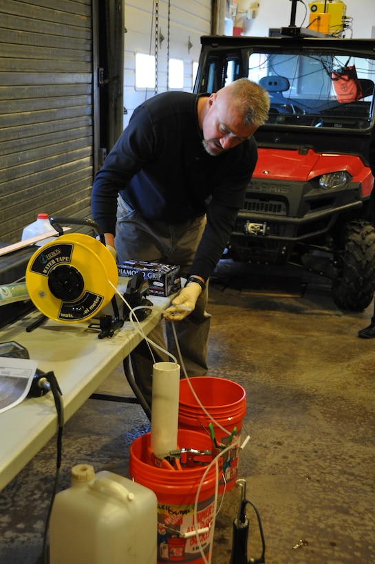 USACE Buffalo District chemists Peter Lorey and Matthew Masset demonstrate water sampling protocols to students from Buffalo, NY area school districts.