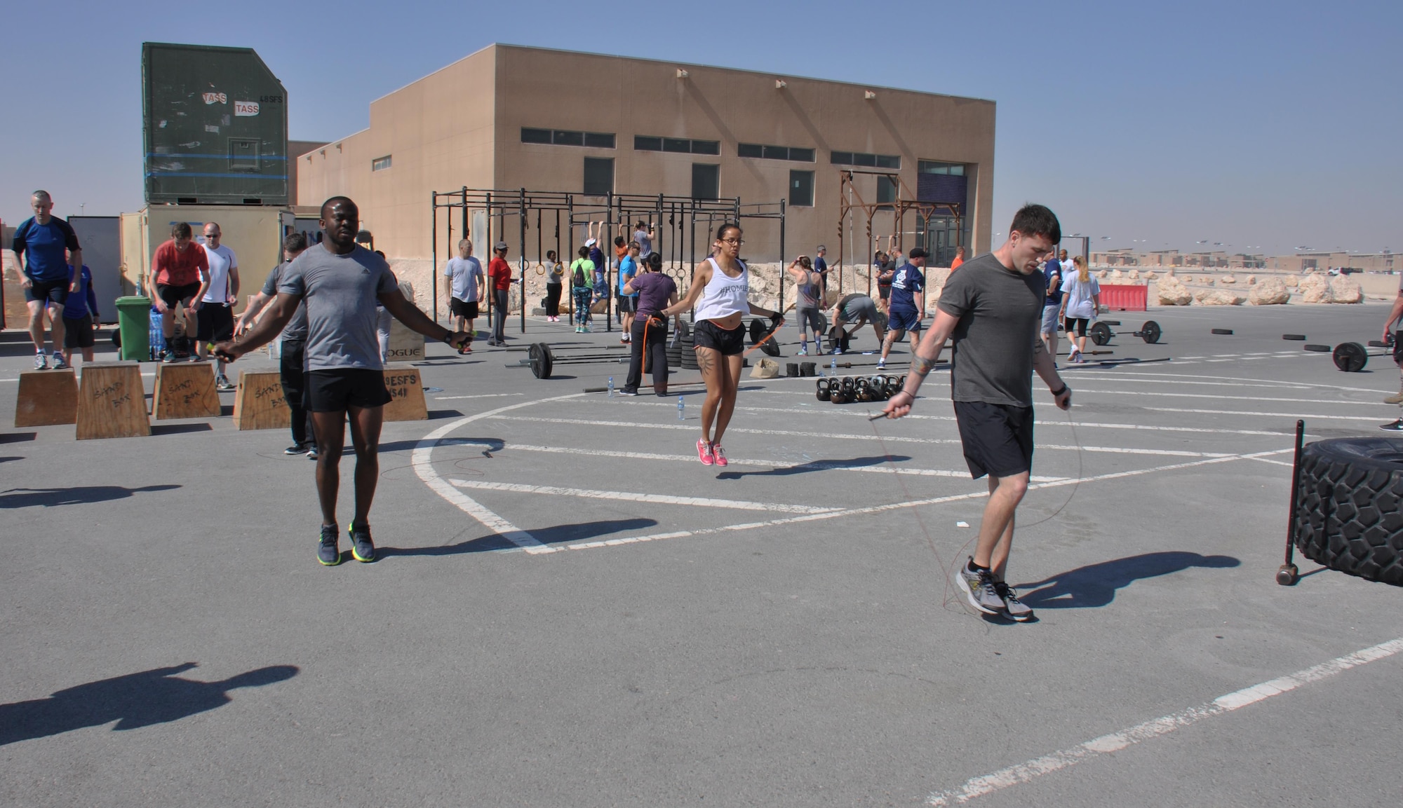 Service members participate in the Cross Fit Undisclosed Suicide Awareness Workout at Al Udeid Air Base, Qatar, Feb. 6. The workout consisted of 22 exercises and participants had to perform 22 reps of each exercise. A moment of silence was observed at minute 22, offering participants an opportunity to reflect on military members who were lost to suicide. (U.S. Air Force photo by Tech. Sgt. James Hodgman/Released)