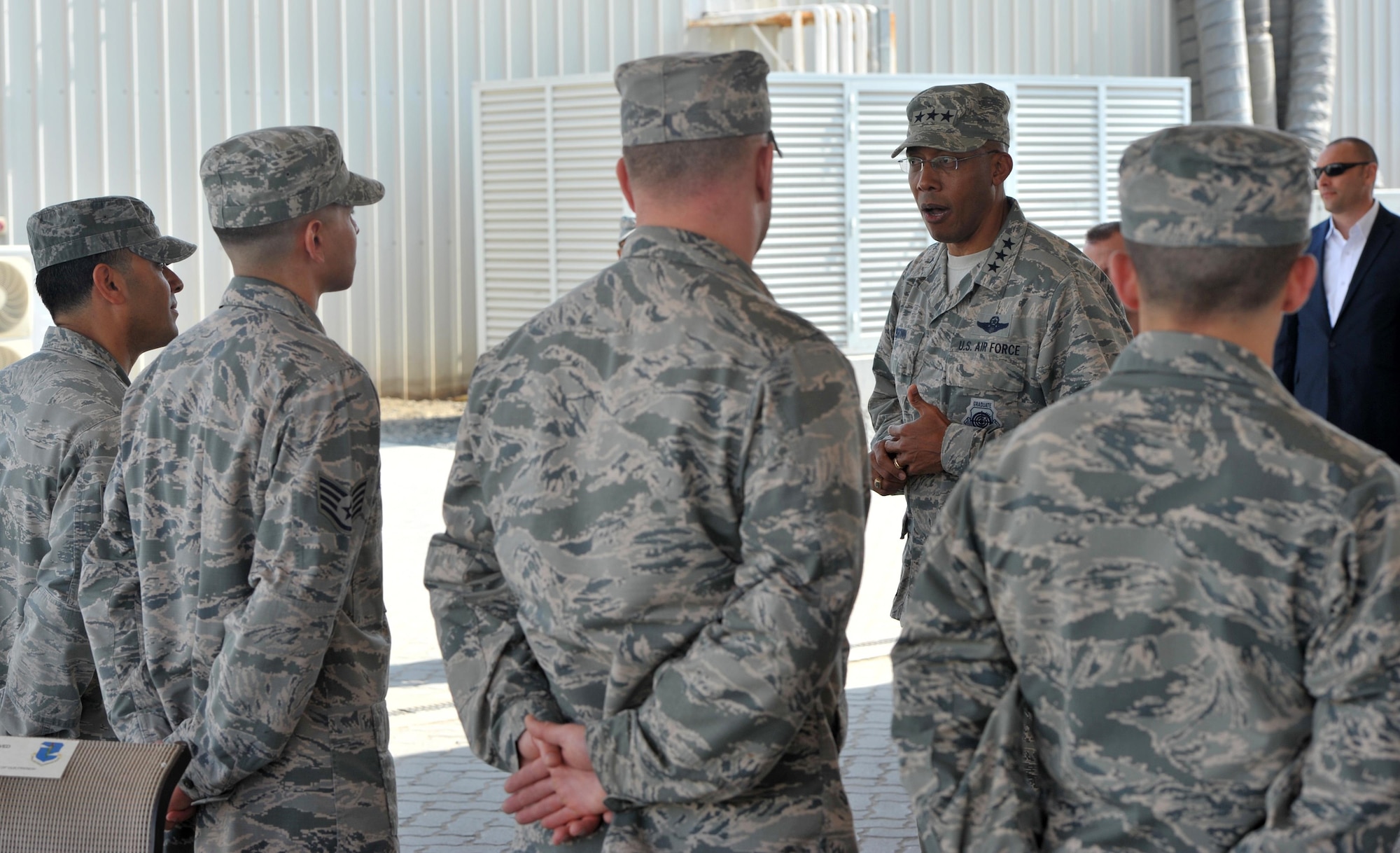 Lt. Gen. Charles Brown Jr., commander of Air Forces Central Command, speaks with 380th Air Expeditionary Wing Airmen at an undisclosed location in Southwest Asia, Feb. 11, 2016. Brown toured several locations around the base before departing later that afternoon. (U.S. Air Force photo by Staff Sgt. Kentavist Brackin/Released)
