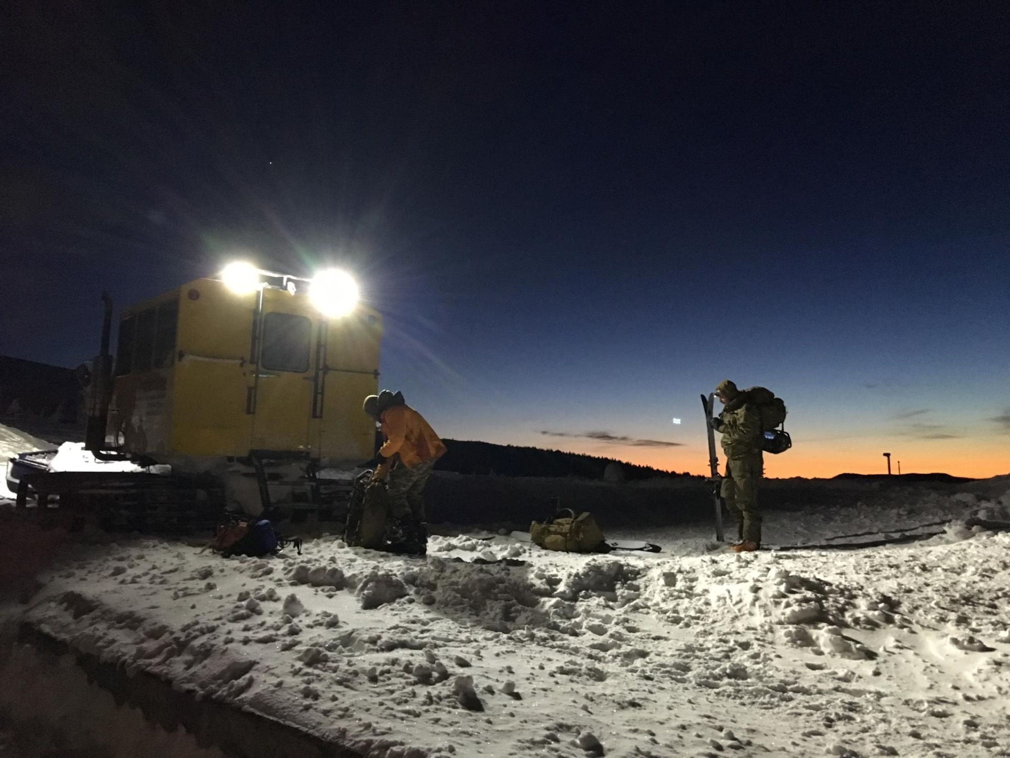 The 304th Rescue Squadron pararescue team from Portland, Ore., inserted onto Mount Hood via a Snowcat at 8,000-foot to begin the search and rescue effort to locate a lost skier at sunrise on Feb. 2, 2016. With the help of local SAR organization they found the skier at 11 a.m. (U.S. Air Force photo/Maj. Chris Bernard) 
