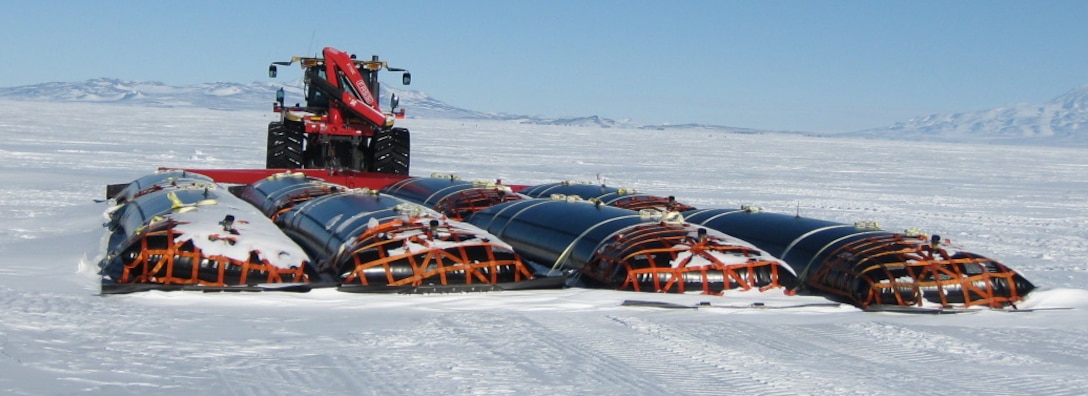 During South Pole Traverse 2010–11, a single tractor could tow eight CRREL-developed black fuel bladders.