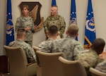 U.S. Air Force Gen. Lori Robinson, U.S. Pacific Air Forces commander, thanks U.S. Army Command Sgt. Maj. John W. Troxell, senior enlisted advisor to the chairman of the Joint Chiefs of Staff (SEAC), for speaking with Airmen, Soldiers, Marines and Sailors about issues concerning the enlisted force during his visit to Hawaii Feb. 10, 2016, at Joint Base Pearl Harbor-Hickam. The talk was part of the SEAC’s visit where he met with U.S. Pacific Command enlisted members and leadership. 