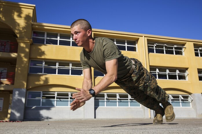Lance Cpl. Grayson S. Osteen, Bravo Company, 1st Recruit Training Battalion, claps while doing a push-up at Marine Corps Recruit Depot San Diego, Feb. 9. Following recruit training, Osteen will report to the School of Infantry at Marine Corps Base Camp Pendleton, Calif., and then to his military occupational specialty school to become an aviation electronics technician. He plans on staying in the Corps as long as possible. 