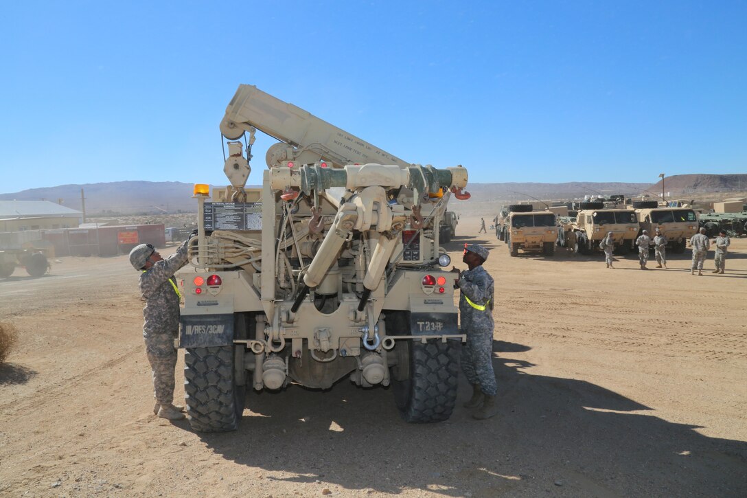 Sergeants Roy Balambao and Franco Banda, recovery specialists with Tomahawk Troop, Regimental Engineer Squadron, 3rd Cavalry Division, U.S. Army out of Fort Hood Texas test a crane on a Hemet Wrecker they are transporting from ECS 171 on Marine Corps Logistics Base Barstow's Yermo Annex to the National Training Center, Fort Irwin for training, Feb. 5. Once done with the equipment, 3rd Cav Soldiers will clean the equipment and ensure that they return it in even better condition than when they received it. 