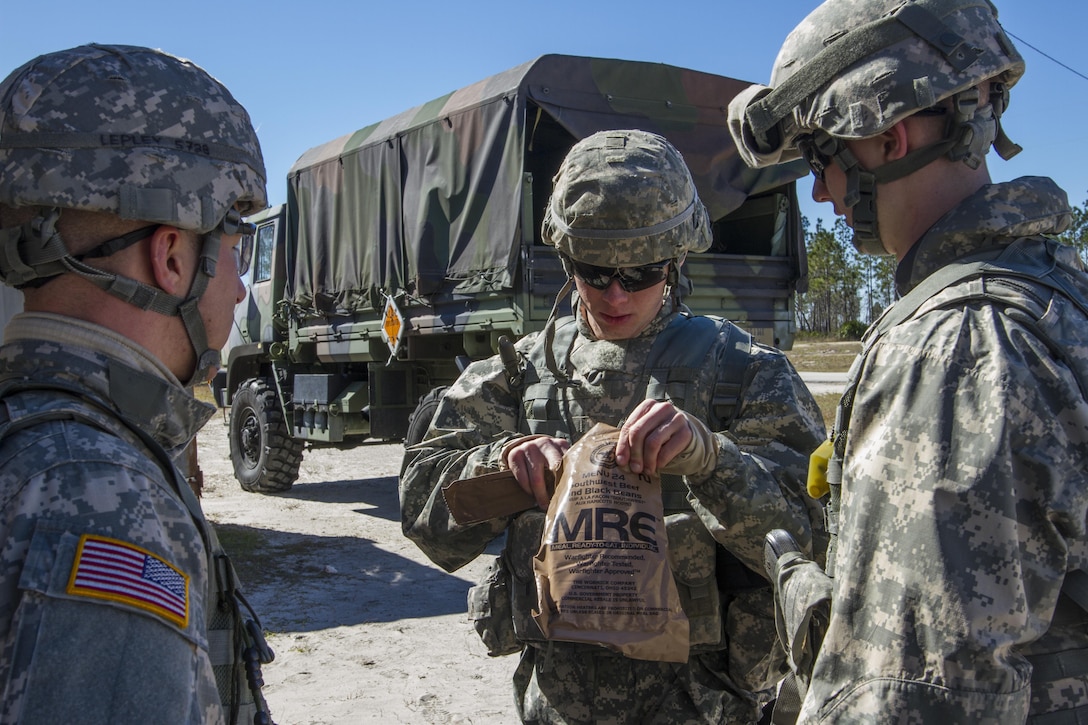 U.S. Army Reserve Spc. Keith Mundorff, an internment and resettlement specialist with the 317th Military Police Battalion from Hanover, Pa., prepares to eat a meal, ready-to-eat, Feb. 10, during weapons qualification at this year's 200th MP Command Best Warrior Competition at Camp Blanding, Fla. The winning noncommissioned officer and junior enlisted competitors will move on to the U.S. Army Reserve Command Best Warrior Competition in May. (U.S. Army photo by Sgt. 1st Class Jacob Boyer/Released)