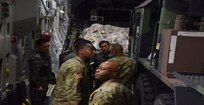 Command Sgt. Maj. Finnis Dodson, 94th Army Air and Missile Defense Command and Command Sgt. Maj. Eric McCray, 35th Air Defense Artillery Brigade, inspect equipment on board a C-17 cargo plane at Osan Air Base, South Korea, Feb 8. The equipment was transported to Korea from Fort Bliss, Texas to support a ballistic missile training exercise on the peninsula, Feb. 8.  (U.S. Army photo/ Capt. William Leasure)