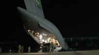 Soldiers from Delta Battery, 1st Battalion, 43rd Air Defense Artillery Regiment, 11 Air Defense Artillery Brigade, unload a Patriot Launching Station onto the runway from a C-17 cargo plane at Osan Air Base, South Korea, Feb. 8. The deployment of this Patriot is part of a coordinated training exercise that was established to increase the readiness of U.S. forces and bolster Ballistic Missile Defense capabilities on the Korean Peninsula. (U.S. Air Force photo/Tech. Sgt. Travis Edwards)