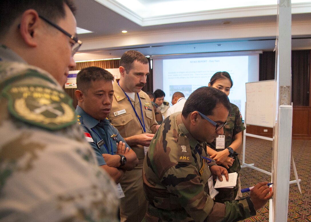 Participants of the Exercise Cobra Gold 16 Medical Symposium work through a humanitarian assistance disaster response scenario Feb. 11 at the K.P. Grand Hotel, Chanthaburi, Thailand. The symposium, Feb. 9-12, focused on the exchange of knowledge and techniques about HADR. As part of the overall focus of CG16, the symposium and other programs will improve the quality of life, as well as the general health and welfare of civilian residents in the exercise areas. 