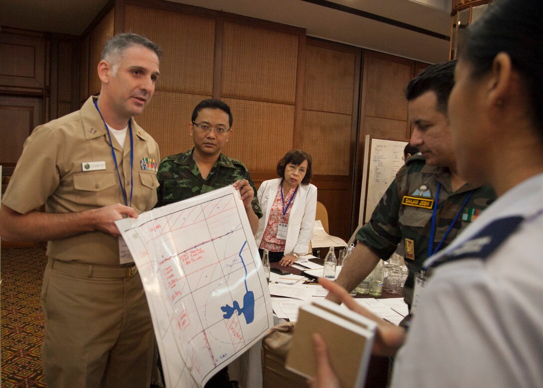 Exercise Cobra Gold 16 Medical Symposium participants look at the layout of the medical camp they created during a humanitarian assistance disaster response table top exercise Feb. 11 at the K.P. Grand Hotel, Chanthaburi, Thailand. The symposium, Feb. 9-12, focused on the exchange of knowledge and techniques about HADR. As part of the overall focus of CG16, the symposium and other programs will improve the quality of life, as well as the general health and welfare of civilian residents in the exercise areas.