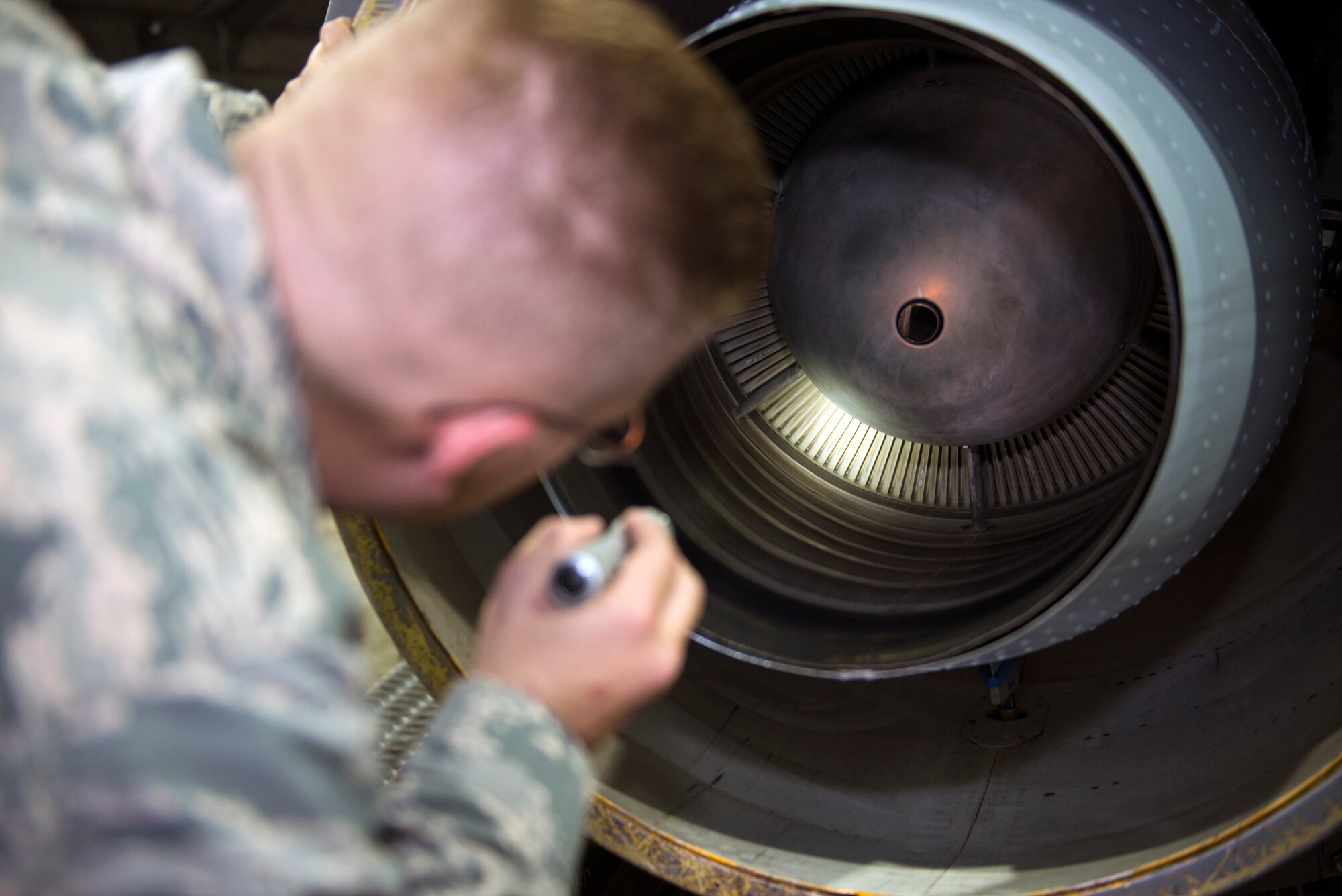 U.S. Air Force Tech. Sgt. Nicholas Wilberger, 23d Component Maintenance Squadron aerospace propulsion craftsman, checks a turbine in a TF-34 engine after an engine run, Feb. 12, 2016, at Moody Air Force Base, Ga. After engine runs, aerospace propulsion technicians check the engines for damages to ensure serviceability before being installed into A-10C Thunderbolt II aircraft. (U.S. Air Force photo by Airman 1st Class Greg Nash/Released)  