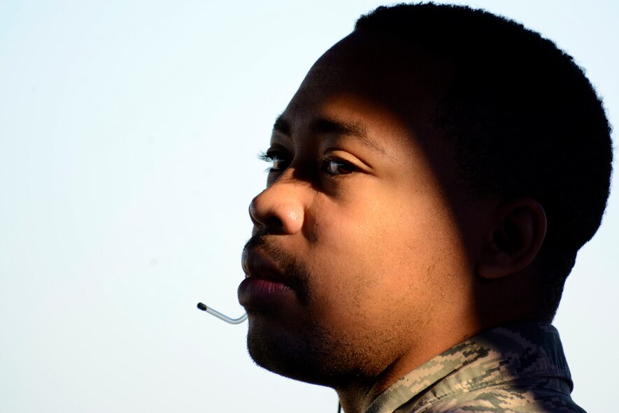 U.S. Air Force Senior Airman Dionte Grant, 20th Operation Support Squadron air traffic control apprentice, relays landing conditions to pilots at Shaw Air Force Base, S.C., Feb. 10, 2016. Airmen assigned to the 20th OSS air traffic control tower work close with pilots to coordinate landings and departures from Shaw. (U.S. Air Force photo by Airman 1st Class Christopher Maldonado) 