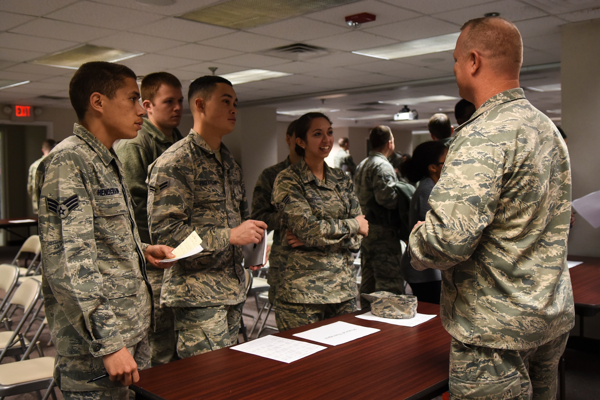 Maj. Joseph Kirkman (right), 4th Medical Operations Squadron physical therapist, speaks to a group of Airmen during a medical commissioning brief, Feb. 9, 2016, at Seymour Johnson Air Force Base, North Carolina. Airmen had the opportunity to directly ask questions about the commissioning process with multiple officers of the 4th Medical Group. (U.S. Air Force photo/Airman Shawna L. Keyes)