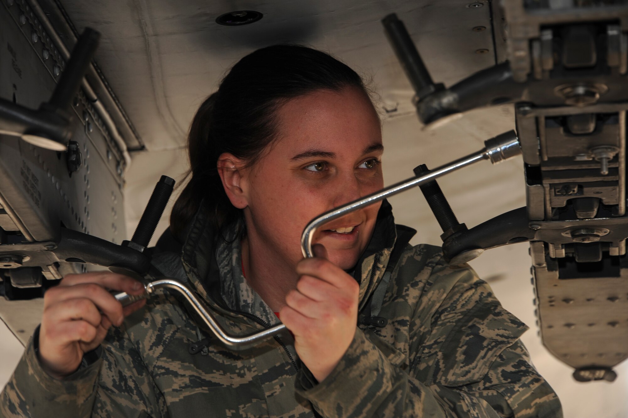 U.S. Air Force Senior Airman Jordann Humphrey, 924th Maintenance Squadron weapons load crew member, prepares to load an A-10C Thunderbolt II during a load crew of the year competition at Davis-Monthan Air Force Base, Ariz., Feb. 5, 2016. The load crews were evaluated on timeliness and number of deficiencies during the competition. (U.S. Air Force photo by Airman Basic Nathan H. Barbour/Released)
