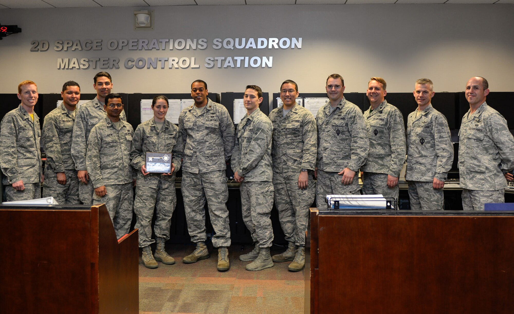 The 2nd and 19th Space Operations Squadrons assume satellite control authority of SVN-70 a GPS IIF-12 satellite, from 14th Air Force (Air Forces Strategic) during a ceremony Feb. 12 at Schriever Air Force Base, Colo. Following its launch from Cape Canaveral Air Force Station, Fla. Feb. 5 operators from the 50th and 310th Space Wings completed an extensive checkout of the satellite before placing it into its assigned orbital slot in the GPS constellation. (U.S. Air Force photo/Christopher DeWitt)