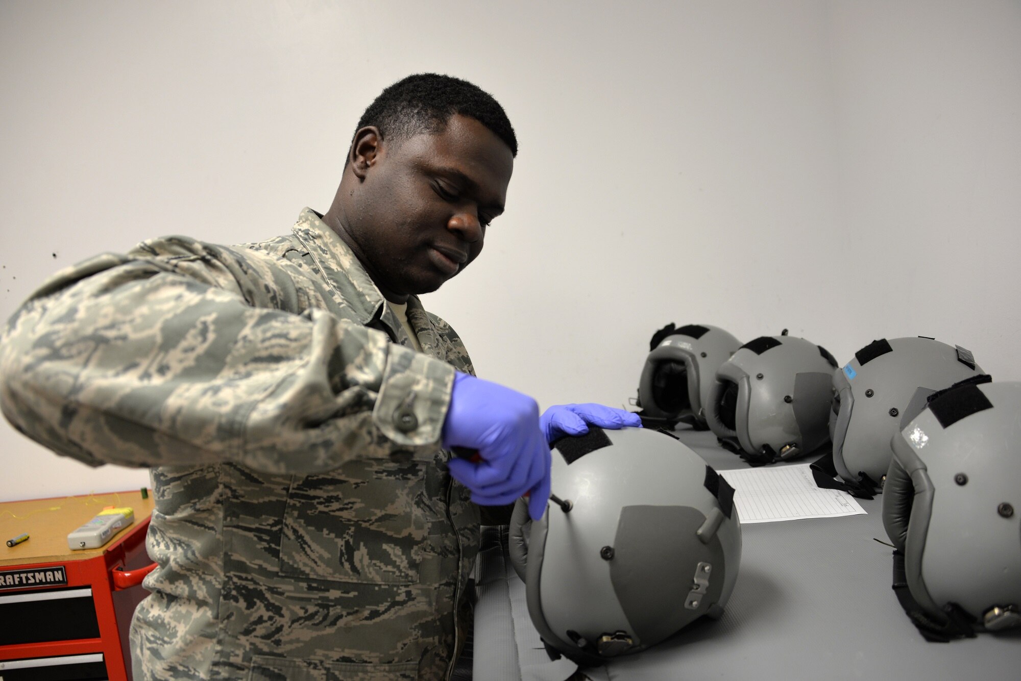 Airman 1st Class Curtis Jones, 60th Operations Support Squadron aircrew flight equipment journeyman, maintains a an aircrew helmet Feb. 10, 2016, at Travis Air Force Base, California. AFE Airmen inspect, maintain and service all aircrew’s gear to ensure it is in working order and has no discrepancies. (U.S. Air Force photo by Staff Sgt. Charles Rivezzo)