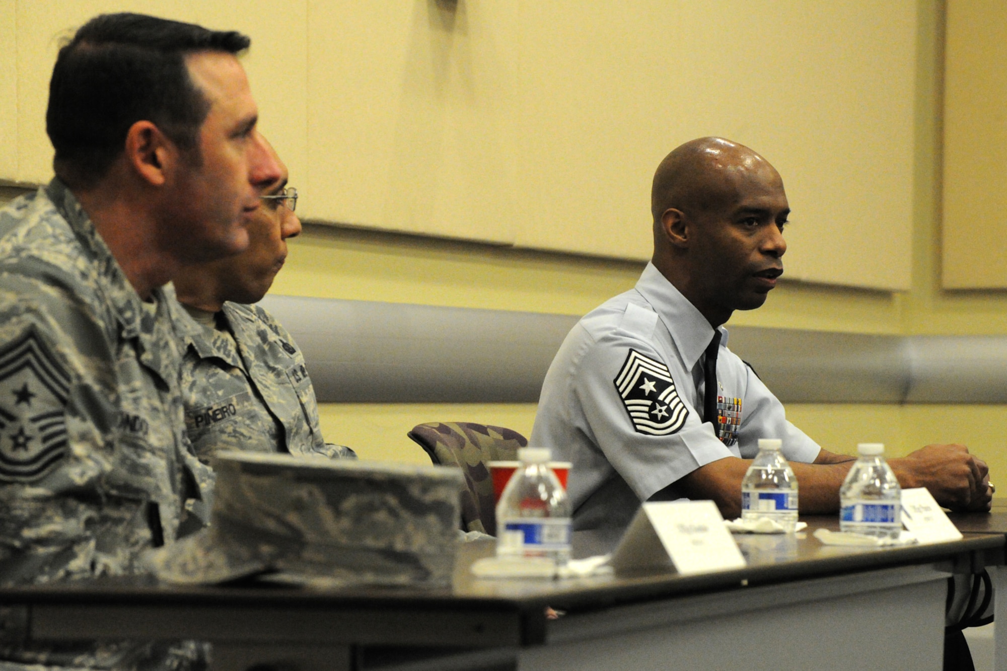 Chief Master Sgt. Vance Kondon, 11th Wing command chief, CMSgt Manuel Pineiro, Air Force District of Washington first sergeant and CMSgt Nathaniel Perry, 79th Medical Wing command chief, speak to participants during Air Force District of Washington’s sixth annual Capital Airmen Development Seminar on Joint Base Andrews, Md., Feb. 10, 2015. The professional development opportunity, which included briefings by senior Air Force leaders, candid discussions, and a tour of the U.S. Capitol building, was designed to increase participants’ understanding of current Air Force issues and programs. 
 (U.S. Air Force photo/Tech. Sgt. Matt Davis)
