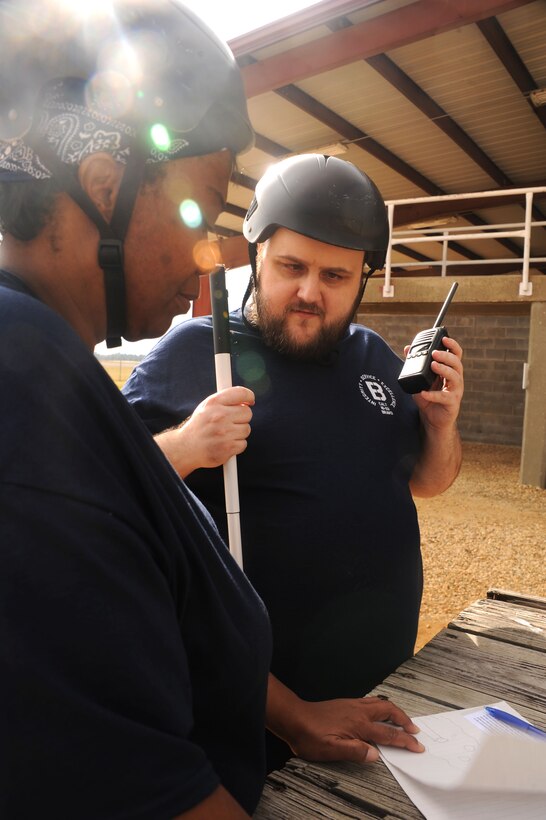 Joseph Lininger, Civilian Acculturation and Leadership Training student, collaborates with a fellow student during a Project X obstacle Feb. 2, 2016, at Maxwell Air Force Base, Alabama. Lininger listens as his classmates describe the obstacle in front of them and then decides the best way for them to execute the mission. (U.S. Air Force photo by Airman 1st Class Alexa Culbert)