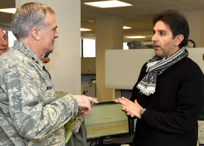 Maj. Gen. Martin Whalen, the Director of Future Operations, talks with Aymen Al-Jababi, a language instructor with the Air Advisor Academy, while touring the U.S. Air Force Expeditionary Center on Feb. 10, 2016 at Joint Base McGuire-Dix-Lakehurst, New Jersey.  Whelan is responsible for establishing and advocating policy, guidance and resources for future air, space and cyberspace operations. (U.S. Air Force photo/Tech. Sgt. Jamie Powell) 