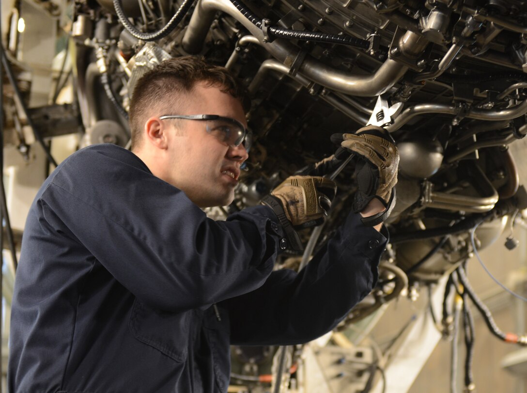 U.S. Air Force Staff Sgt. Christopher Hudson, 7th Component Maintenance Squadron test cell craftsman, completes performance adjustments on a B-1B Lancer/F101 engine after an idle engine check Dec. 22, 2015, at Dyess Air Force Base, Texas. Before testing the engine at a high RPM rate, test cell Airmen first run the engine at idle to check performance at lower settings.  After making performance adjustments at idle, engine run personnel perform another idle engine check, and test the engine at its peak RPM levels. (U.S. Air Force photo by 2nd Lt. Lauren Linscott/Released)