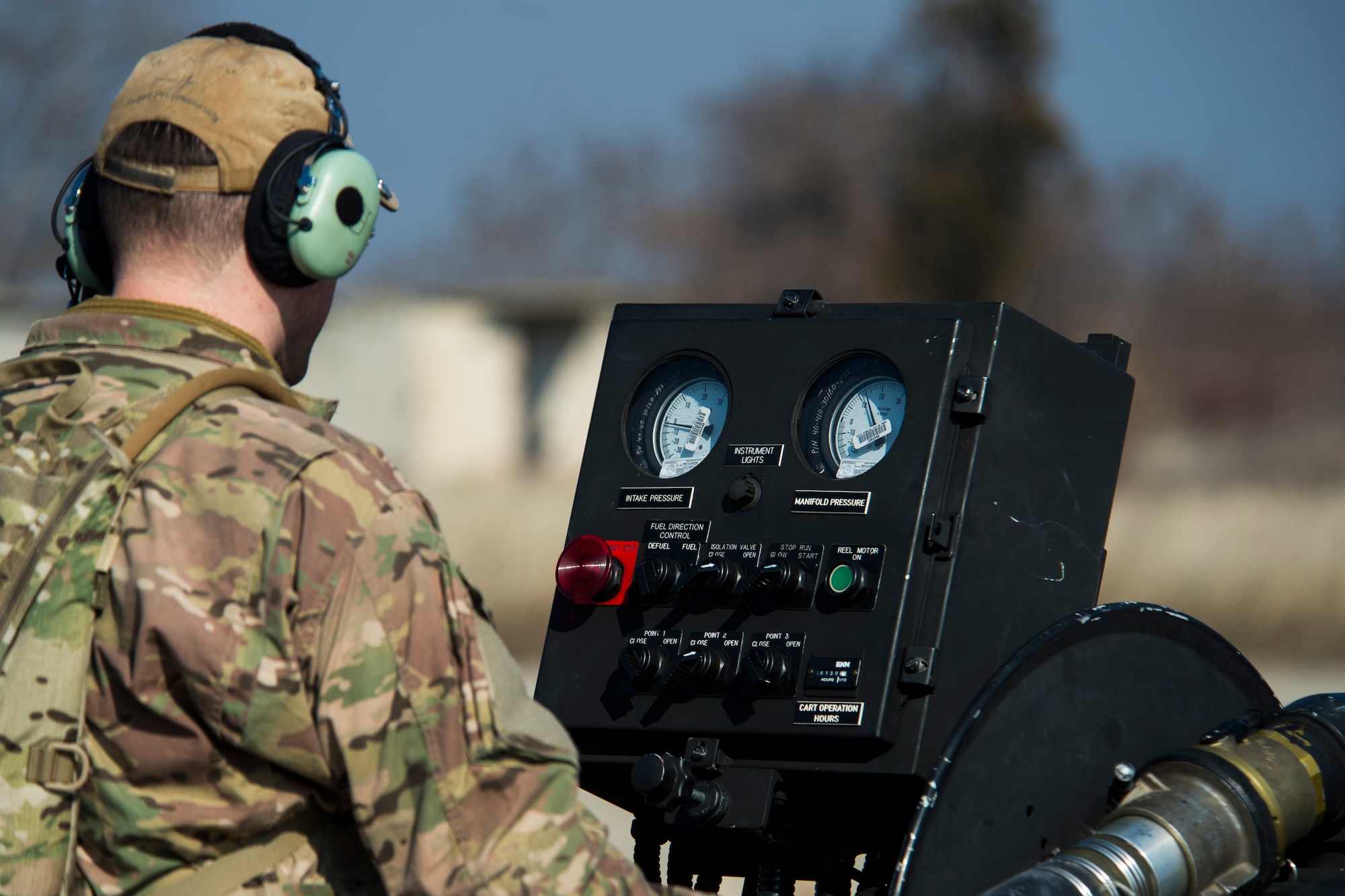 A member of the 67th Special Operations Squadron watches gages on a forward area manifold cart while refueling a 74th Expeditionary Fighter Squadron A-10C Thunderbolt II aircraft during forward area refueling point training at Plovdiv, Bulgaria, Feb. 9, 2016. A single A-10 usually receives approximately 2,000 pounds of fuel in a five-to-seven-minute span during FARP training. (U.S. Air Force photo by Airman 1st Class Luke Kitterman/Released)