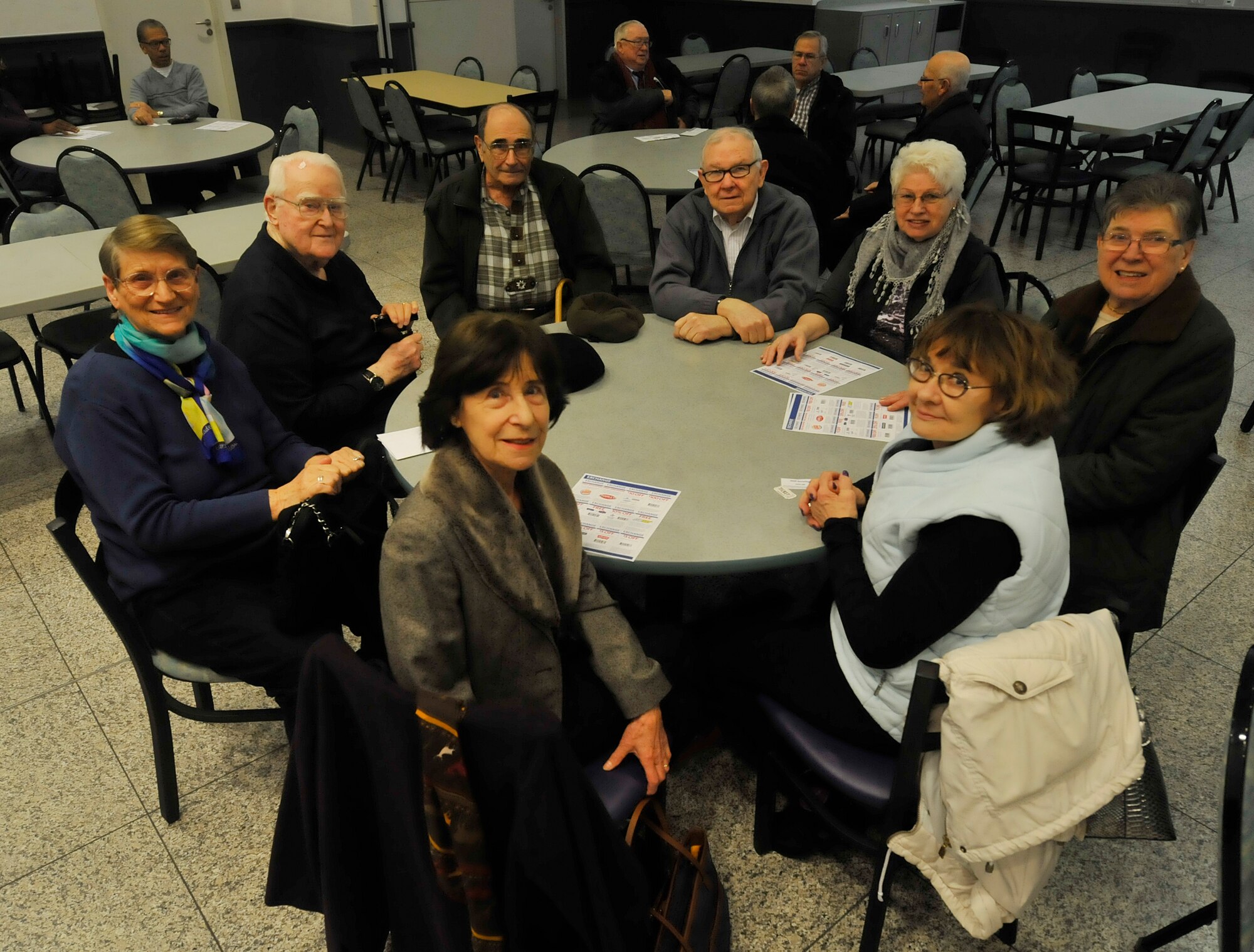 Retirees and their spouses pose for a photo during the first retiree luncheon sponsored by the 86th Airlift Wing Retiree Activities Office Feb. 11, 2016, at Ramstein Air Base, Germany. The retiree luncheon was one of many events offered to retirees in the community. The RAO is reaching out to retirees by offering assistance with as their new program which enables retirees to assist other retirees in need. (U.S. Air Force photo/Airman 1st Class Larissa Greatwood)