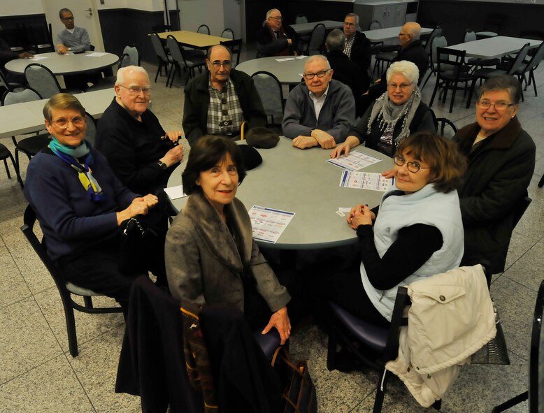 Retirees and their spouses pose for a photo during the first retiree luncheon sponsored by the 86th Airlift Wing Retiree Activities Office Feb. 11, 2016, at Ramstein Air Base, Germany. The retiree luncheon was one of many events offered to retirees in the community. The RAO is reaching out to retirees by offering assistance with as their new program which enables retirees to assist other retirees in need. (U.S. Air Force photo/Airman 1st Class Larissa Greatwood)