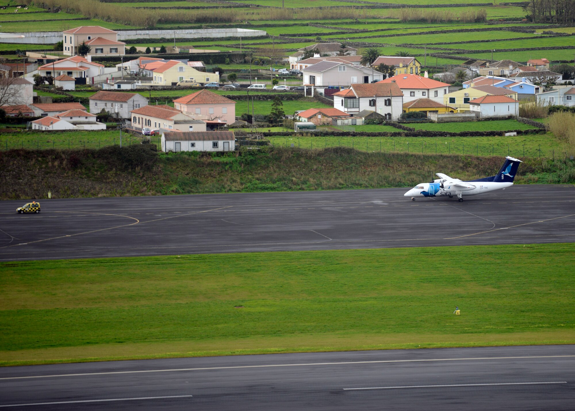 A commercial aircraft lands at Lajes Field, Azores, Feb. 7, 2016. The flightline at Lajes Field is operated by the 65th Air Base Group and shared by the local airport for all passengers coming to the island. The field became a geographically separated unit of the 86th Airlift Wing in August, 2015. (U.S. Air Force photo/Tech. Sgt. Kristopher Levasseur)