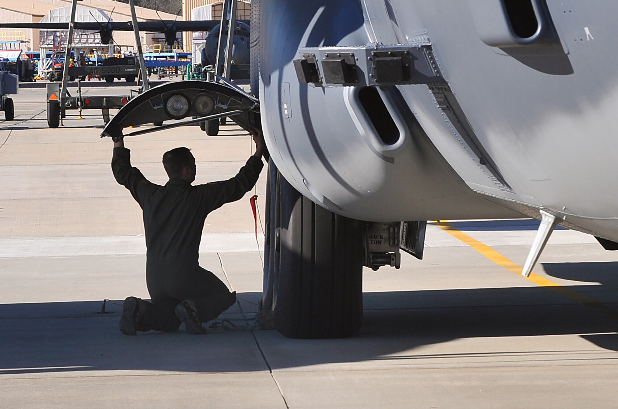 An Air Force Special Operations Command Airman conducts a pre-flight inspection prior to returning an AC-130 worked on at Robins to its home unit. (U.S. Air Force photo by Tommie Horton)