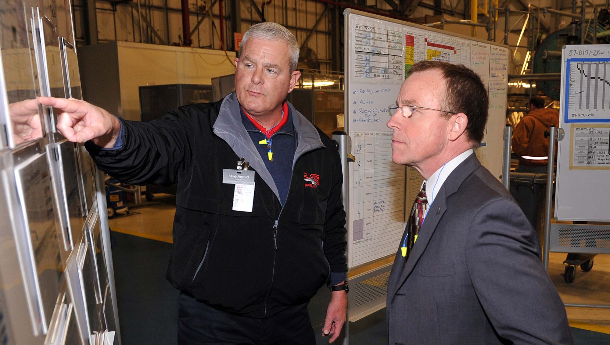 Mike Arnold, 561st Aircraft Maintenance Squadron director, briefs Jeffrey Allen, Air Force Sustainment Center executive director, on F-15 transition plans during his visit to the Warner Robins Air Logistics Complex Feb. 7 through 9. (U.S. Air Force photo by Tommie Horton)