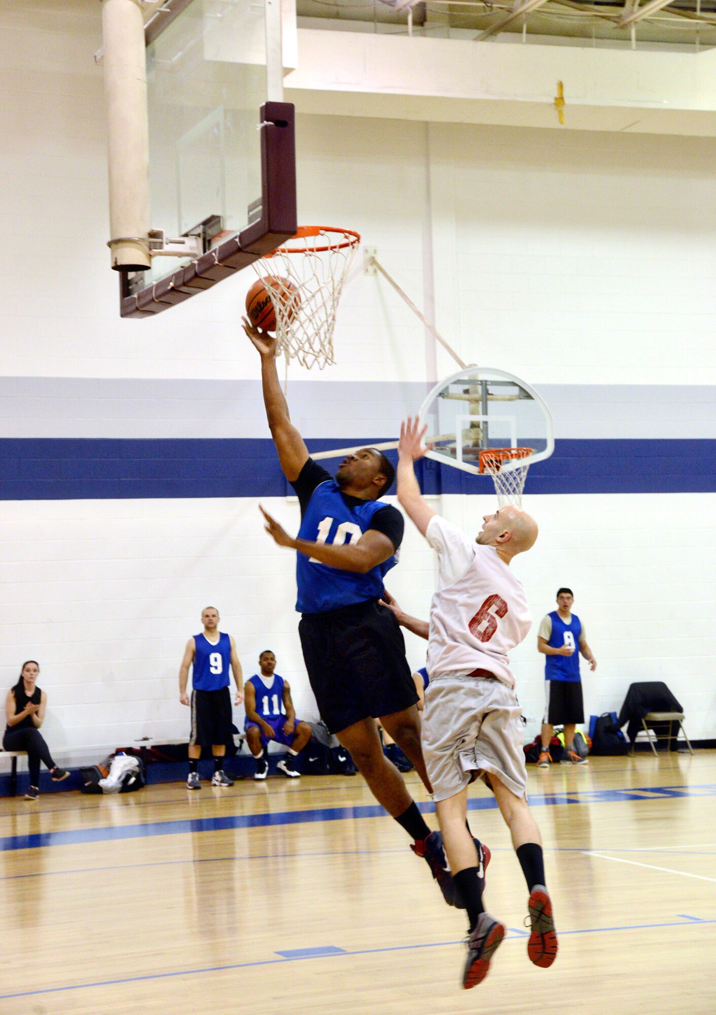 Shawn Simmons of the 552 OSS gets by No Games This Week’s Andrew Kasman for a layup during a Feb. 4 intramural contest. The 552 OSS defeated No Games This Week 30-27. (Air Force photo by Kelly White/Released)