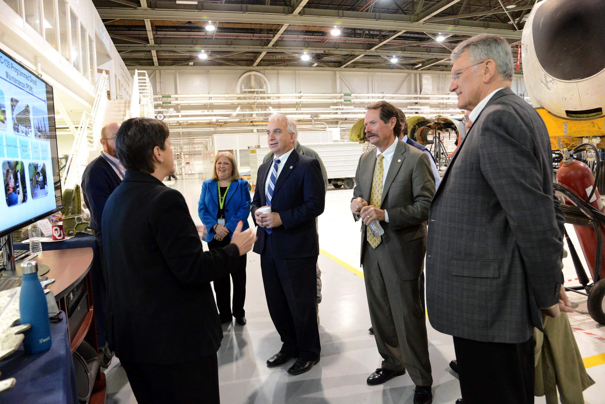 Theresa Farris, 564th Aircraft Maintenance Squadron’s civilian director, discusses the KC-135 Programmed Depot Maintenance line with Janis Wood, 76th Aircraft Maintenance Group deputy director; the Honorable Chris Benge, the Oklahoma Secretary of State and Native American Affairs; Vince Howie, Aerospace and Defense director for the Oklahoma Department of Commerce; and the Honorable Gary Banz, the Oklahoma State House of Representatives, District 101. On Feb. 5, the distinguished visitors toured several Tinker organizations, including the Oklahoma City Air Logistics Complex, the 552nd Air Control Wing and the 72nd Air Base Wing.  (Air Force photo by Kelly White/Released)