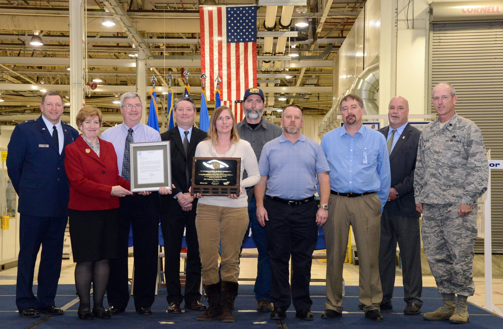 Representing the 76th Propulsion Maintenance Group are, from left, Brig. Gen. Mark K. Johnson, Maureen Sullivan, Greg Tunnell, David Bates, Erica Ross, Jim Bligh, Timothy Earls, Daryl Newton, Carl Dahms, Lt. Col. Michael Allison. (Air Force photo by Kelly White/Released)