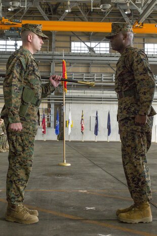 Sgt. Maj. Darnell Richardson, right, outbound Marine Aviation Logistics Squadron 12 sergeant major, returns the sword of office to Lt. Col. Kolter Miller, MALS-12 commanding officer, during a relief and appointment ceremony at Marine Corps Air Station Iwakuni, Japan, Feb. 12, 2016. This ceremony symbolizes the end of Richardson’s role as MALS-12 sergeant major. The passing of the sword of office represents the transferring of duties and responsibilities from one sergeant major to another.
