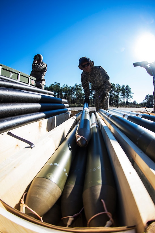 Army Pfc. Alejandro Martinez places a felchette rocket in a storage bin after removing packing material on Marine Corps Outlying Field Atlantic, N.C., Feb. 8, 2016. Army photo by Staff Sgt. Christopher Freeman
