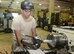 Senior Airman Alex Villanueva, 36th Maintenance Squadron aircraft metals technology journeyman, uses a lathe machine to turn down a piece of metal Feb. 2, 2016, at Andersen Air Force Base, Guam. The aircraft metals technology section consist of machinists and welders responsible for anything that entails small intricate parts that needs to be extremely accurate down to a thousandths of an inch. (U.S. Air Force photo/Airman 1st Class Arielle Vasquez)
