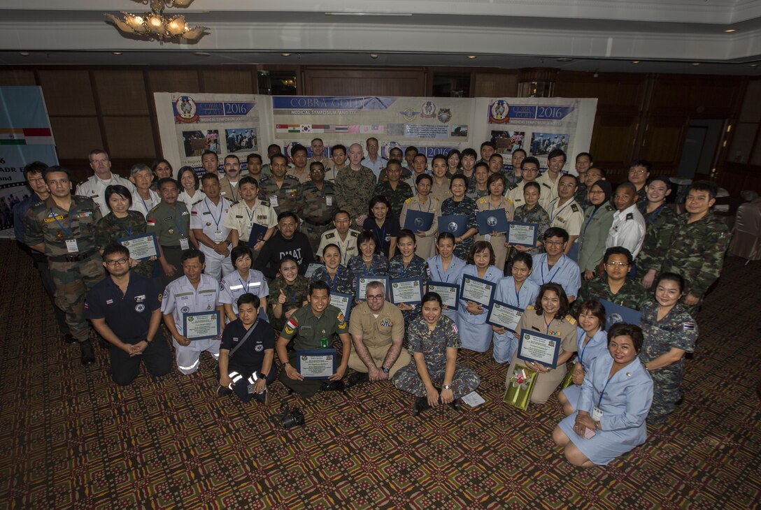 Attendees of the Medical Symposium pose for a group photo in Chanthaburi, Thailand, during exercise Cobra Gold, Feb. 12, 2016. Cobra Gold 2016, in its 35th iteration, includes a specific focus on humanitarian civic action, community engagement, and medical activities conducted during the exercise to support the needs and humanitarian interests of civilian populations around the region. 