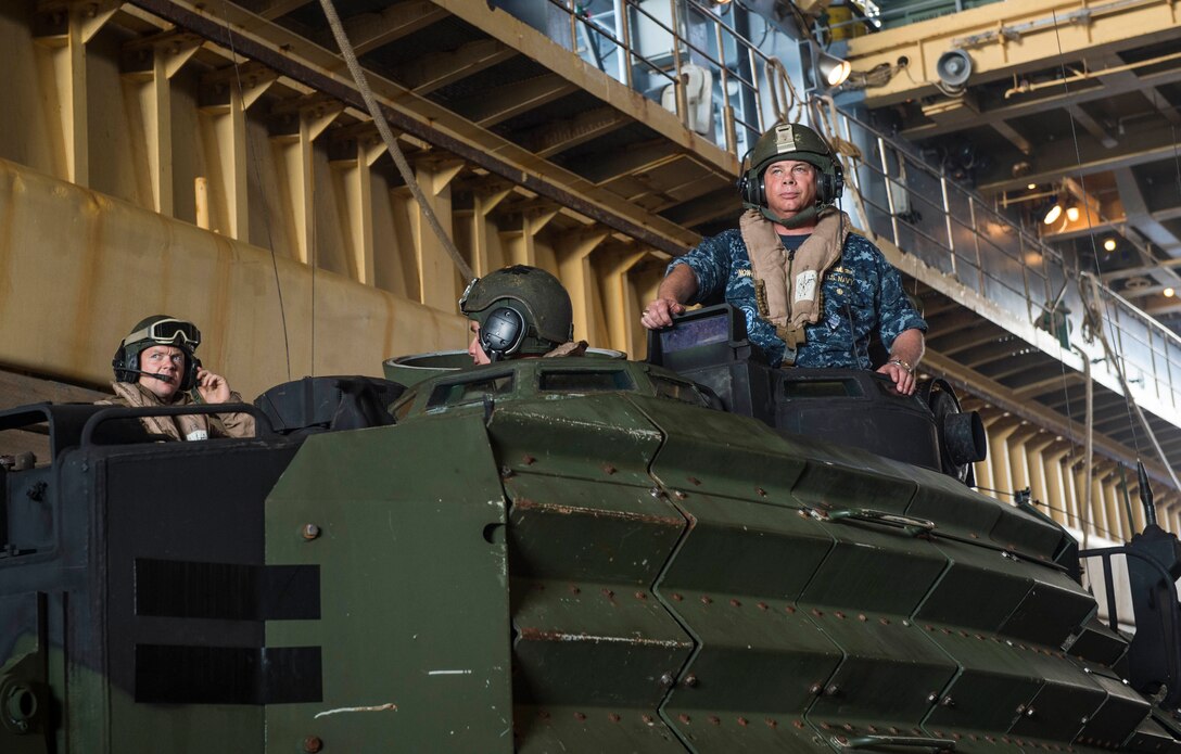 Rear Adm. John B. Nowell, commander Task Force (CTF) 76, prepares for the amphibious assault vehicle (AAV) to be launched from amphibious dock landing ship USS Ashland (LSD 48). Ashland is assigned to the Bonhomme Richard Ready Group, and is participating in exercise Cobra Gold 16, a Thai-U.S. co-sponsored multinational joint exercise designed to advance regional security by exercising a robust multinational force from nations sharing common goals and security commitments in the Indo-Asia-Pacific region.