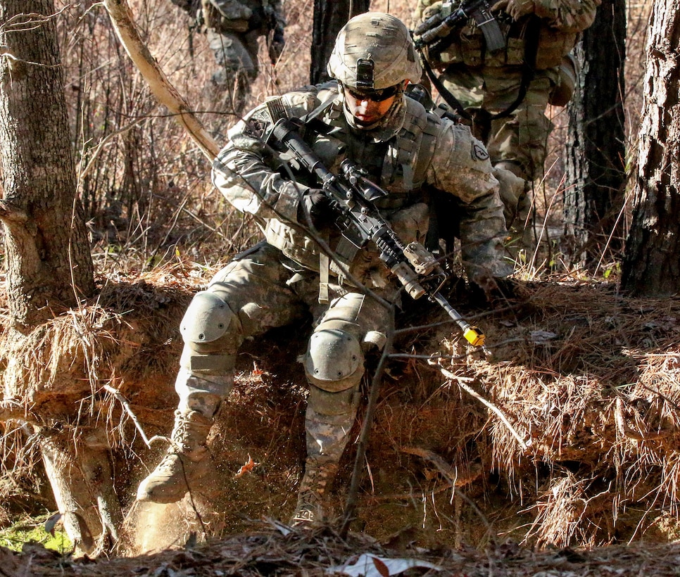 A paratrooper drops into a narrow draw while moving toward an objective at the Joint Readiness Training Center’s Peason Ridge on Fort Polk, La., Feb. 13, 2016. The paratrooper is assigned to the 25th Infantry Division’s 1st Battalion, 501st Infantry Regiment, 4th Brigade Combat Team, Airborne. Army photo by Staff Sgt. Sean Brady