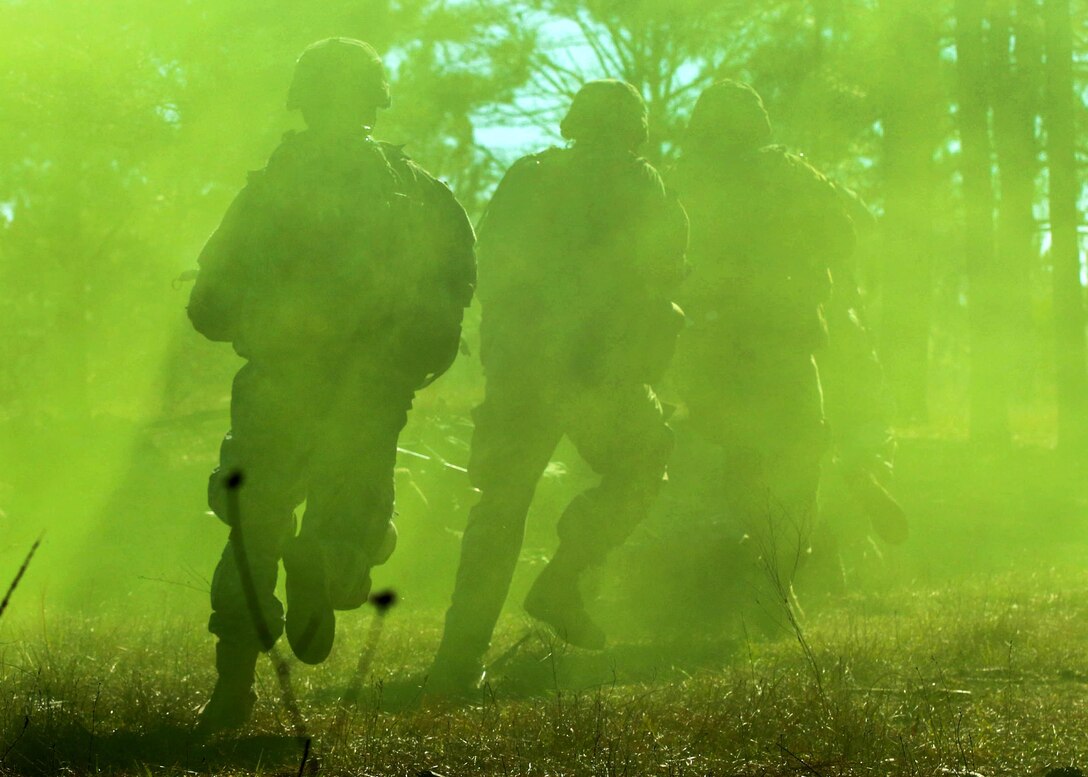 Paratroopers run through smoke to mask their movements while assaulting an objective at the Peason Ridge area of Fort Polk, La., Feb. 13, 2016. Army photo by Staff Sgt. Sean Brady